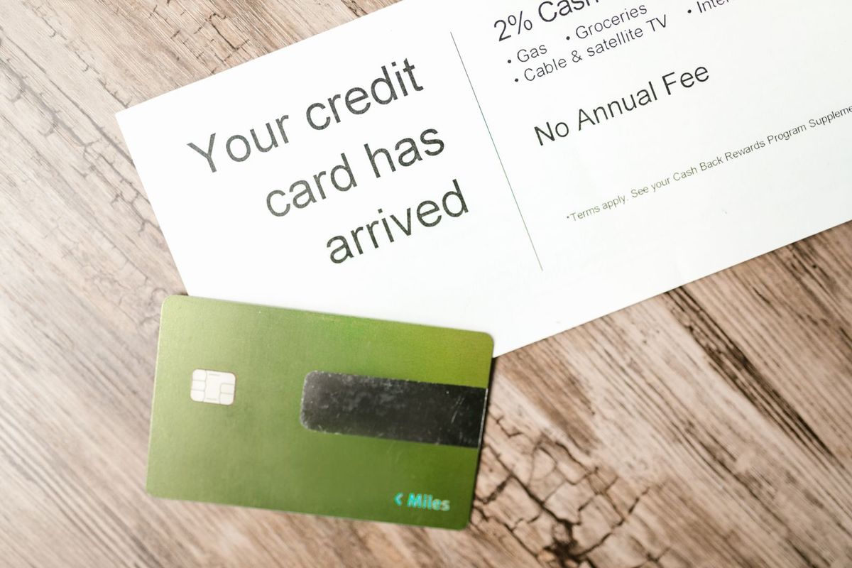 Credit card debt relief in West Virginia — card beside a financial document