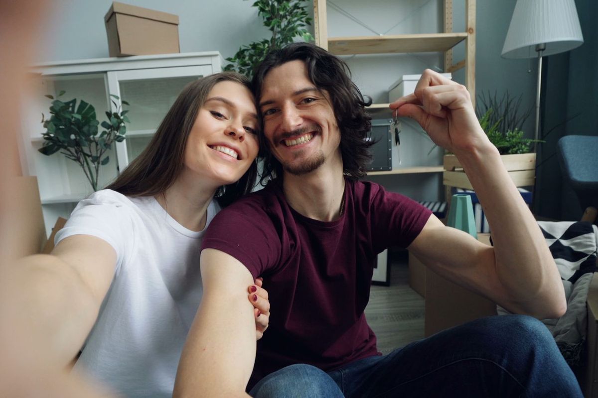 Payday Loan Relief in Charleston, WV — couple in a new home with boxes