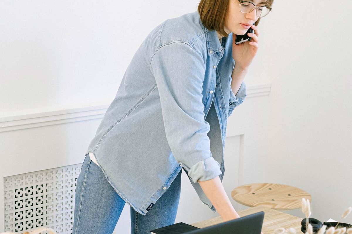 How to Avoid Bankruptcy — woman on a phone call in an office