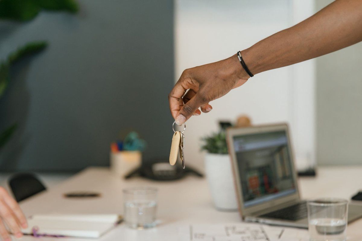 Debt Relief Instead of Bankruptcy — keys handed over at a desk
