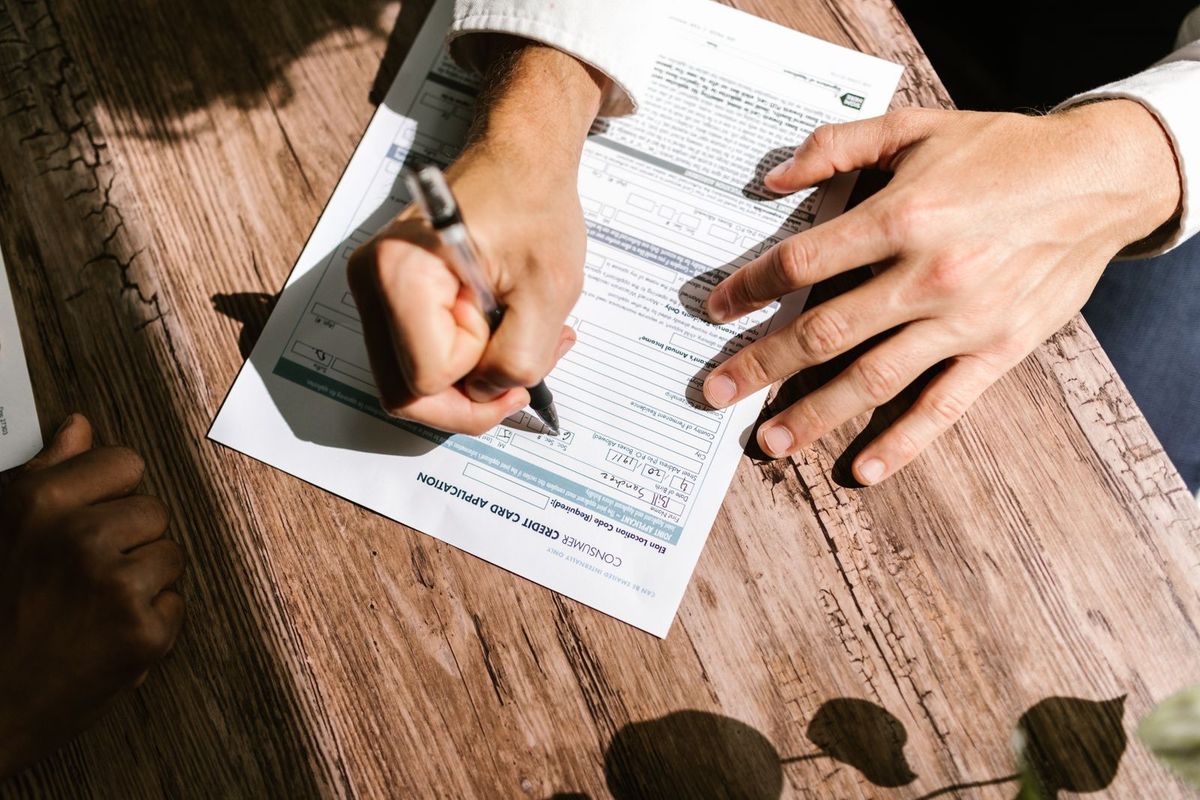 Debt Negotiation Services — writing on a document