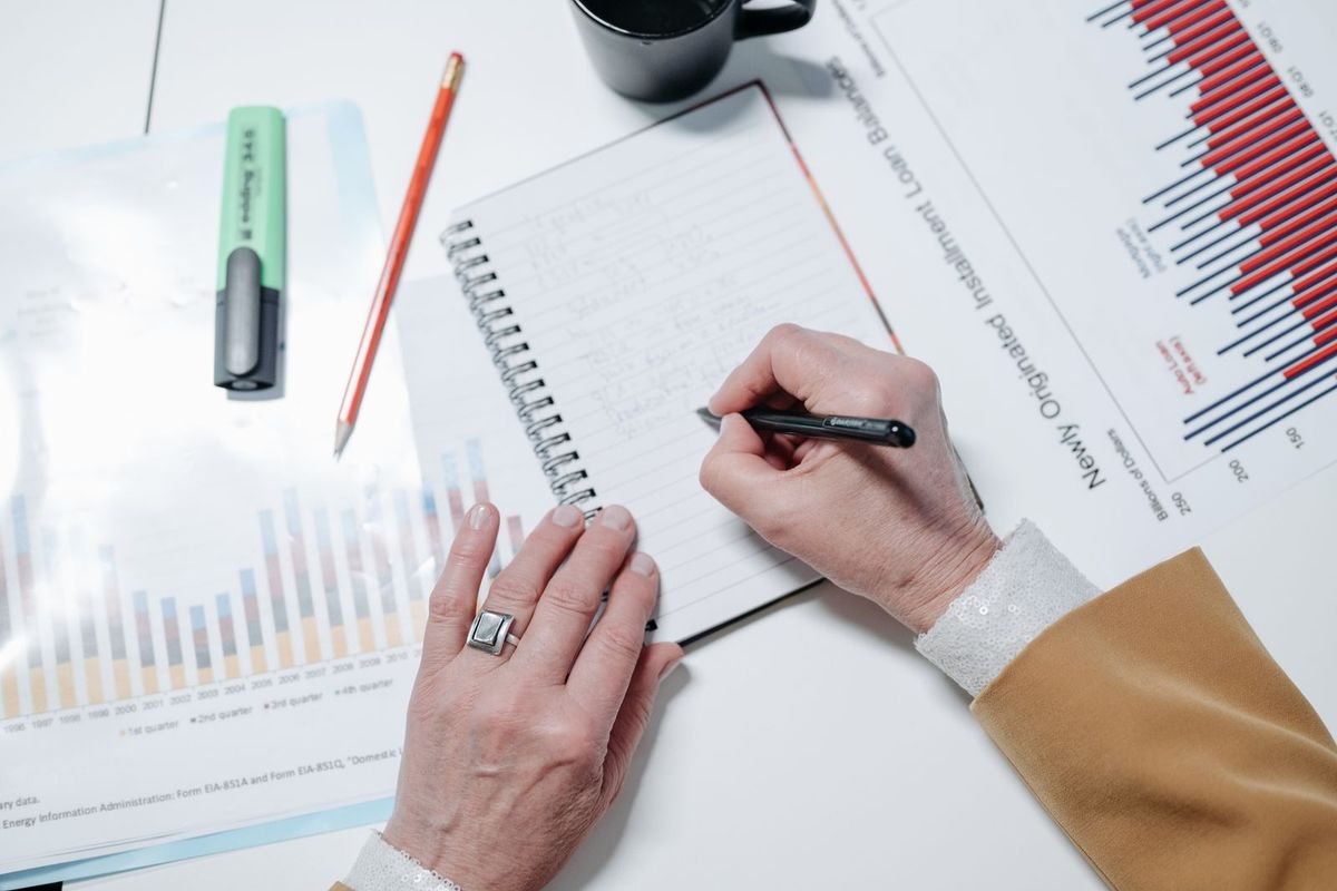 Debt consolidation loans in Charleston, WV — person writing in a notebook