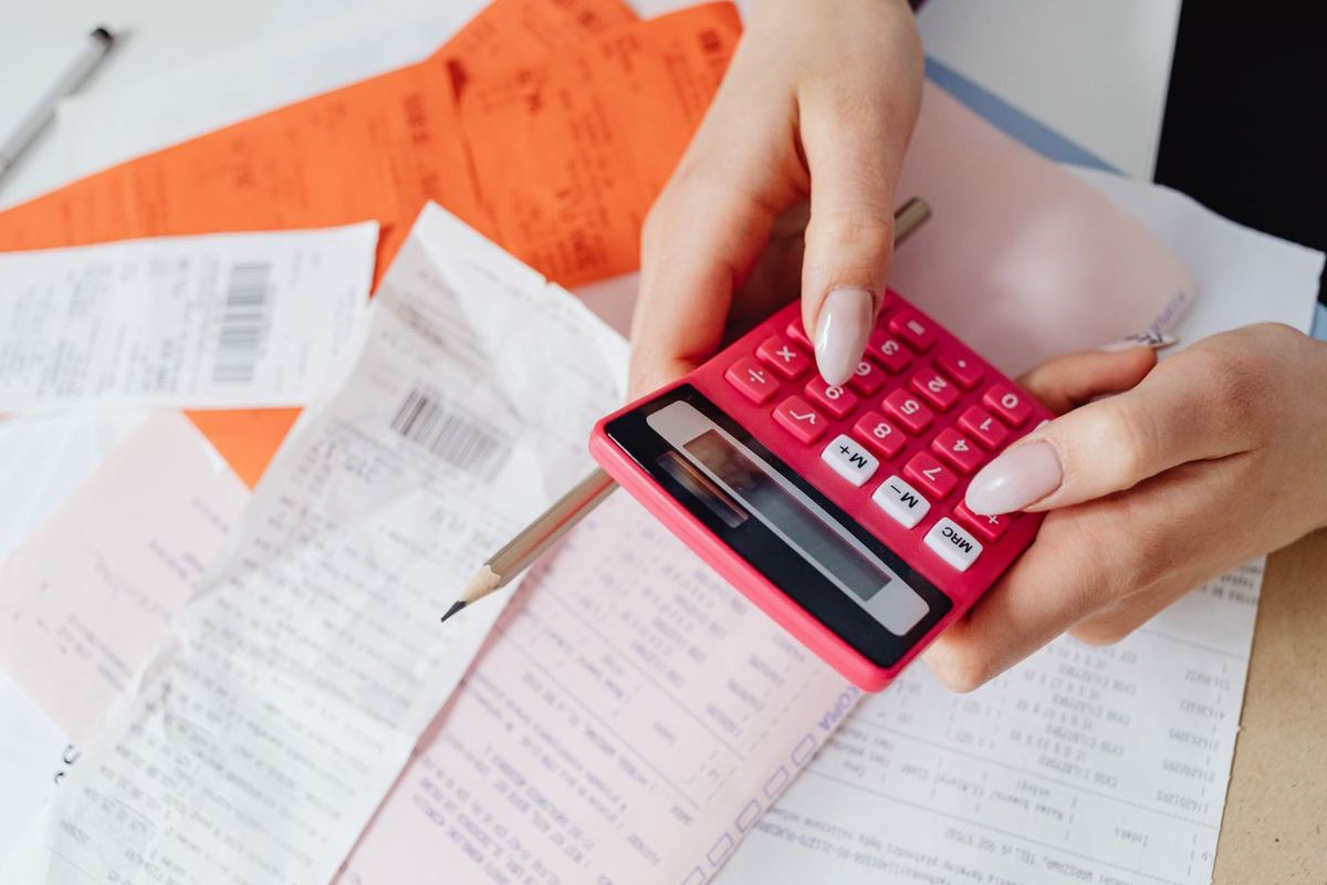 Debt Relief Instead of Bankruptcy — tallying expenses with a calculator