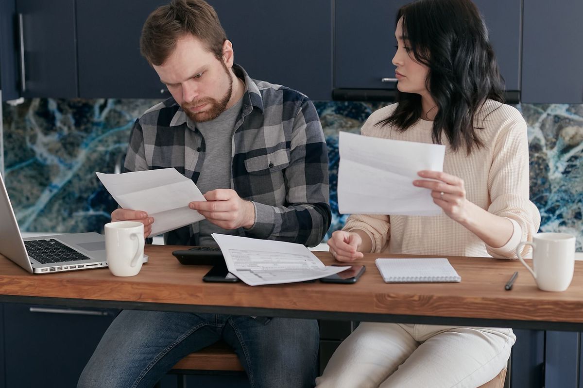 Debt Relief Instead of Bankruptcy — couple reviewing bills together