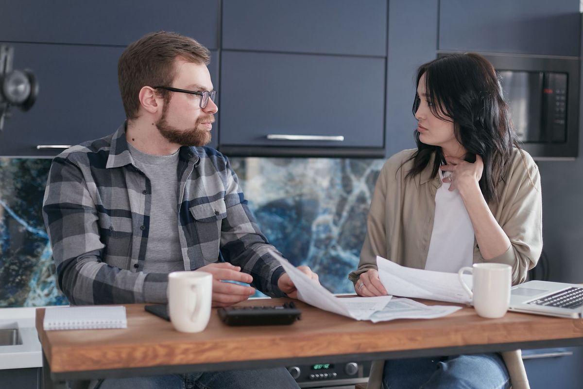Debt consolidation loans in Wheeling, WV — couple talking about their finances