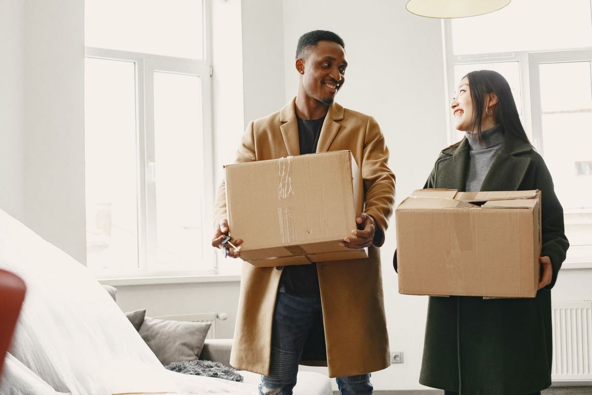 Bankruptcy Alternatives — couple carrying boxes into a new home