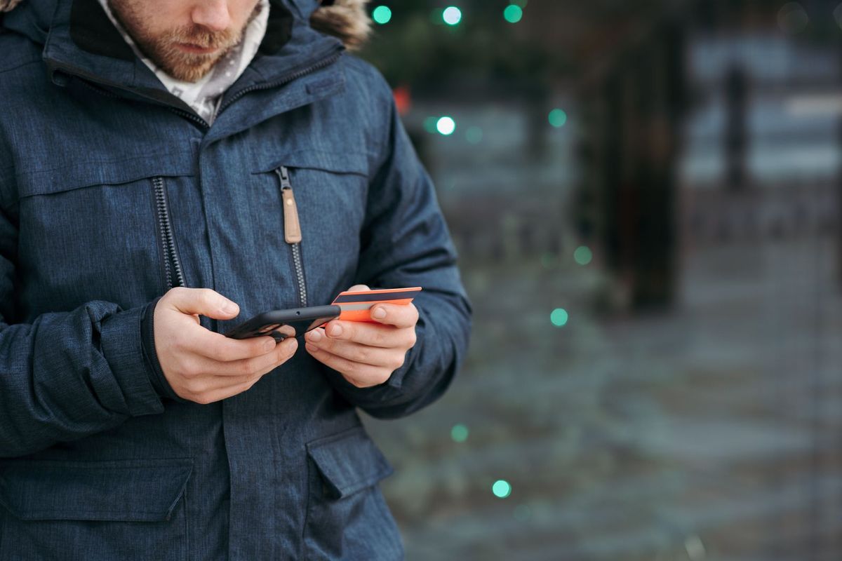 Alternatives to Chapter 13 — man browsing his account with a card in hand