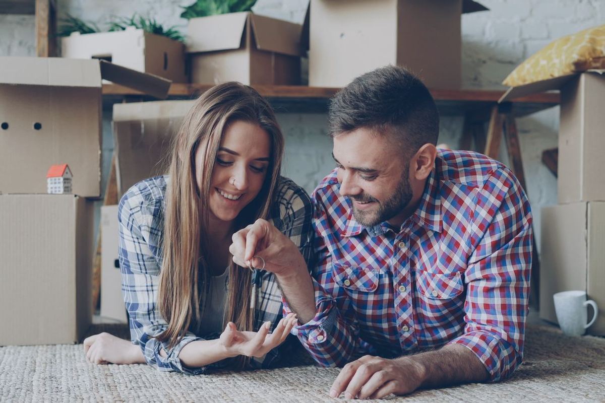 Loan Credit Repair — Franklin, WV Loan Credit Repair in Franklin, WV — couple relaxing among moving boxes