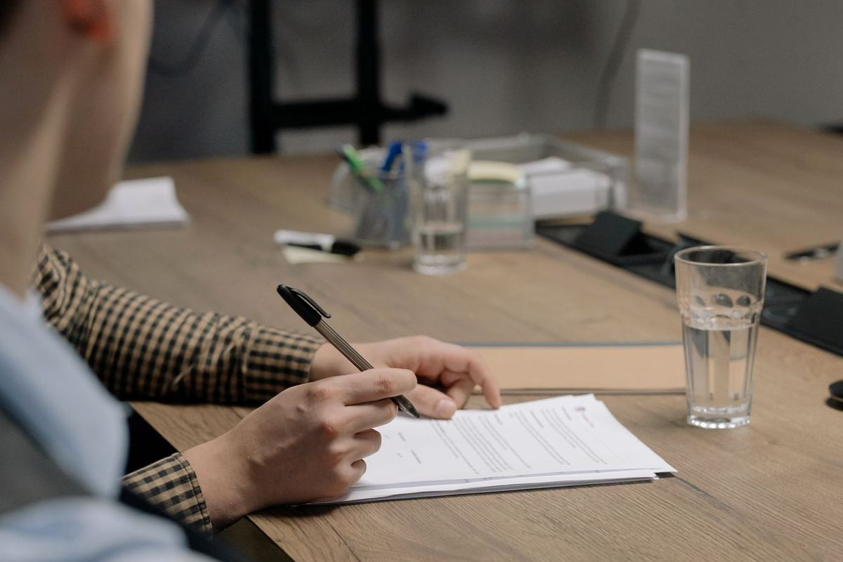 Loan Credit Repair in West Virginia — signing a document at a table