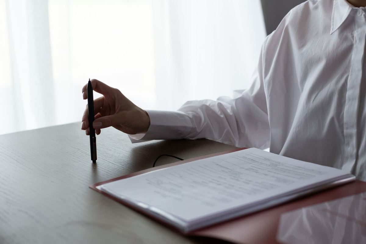 Loan Credit Repair in West Virginia — reviewing paperwork with a pen
